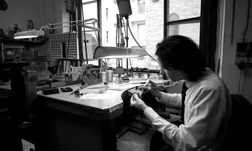 Craftsman working on a jewel in the workshop