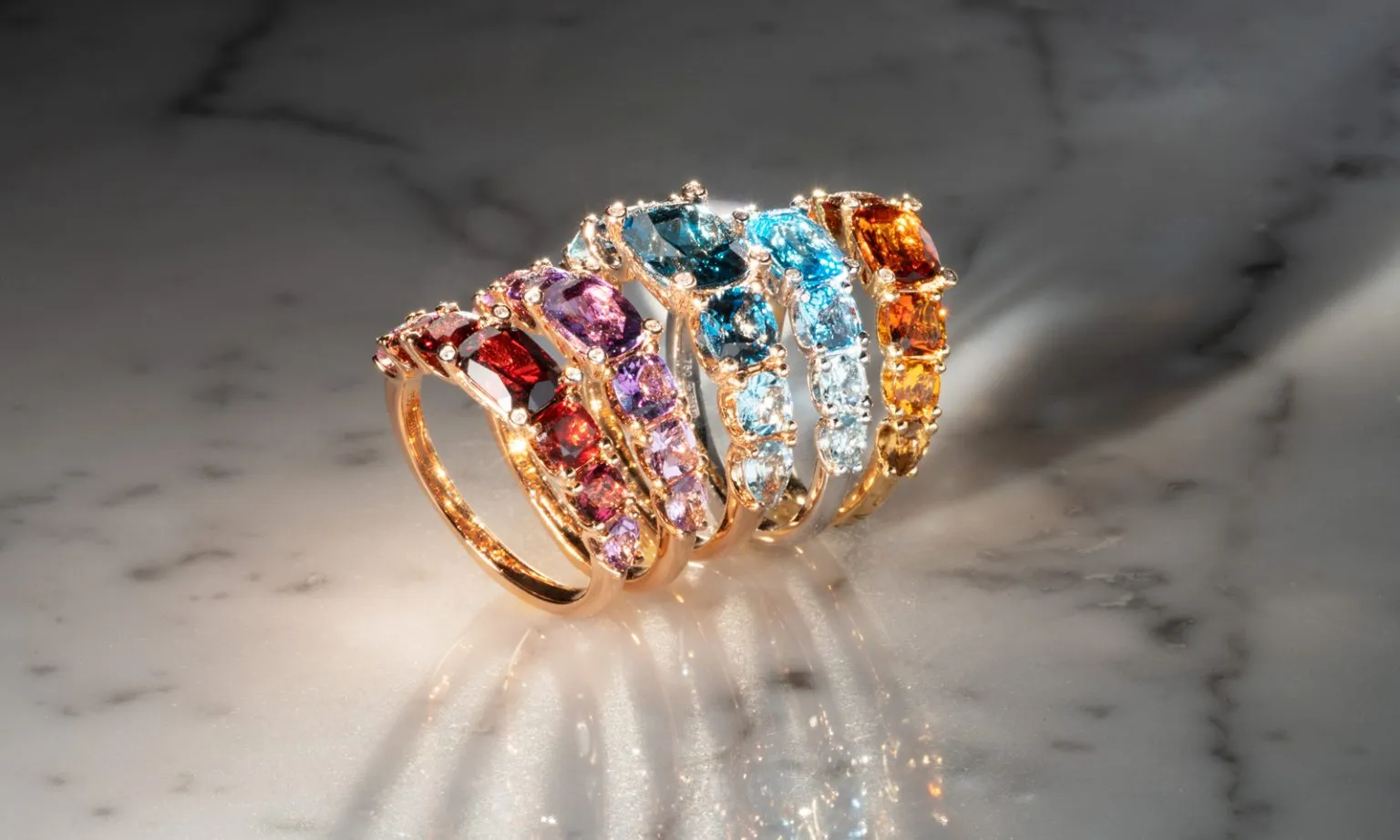 Iris collection rings with colored gemstones