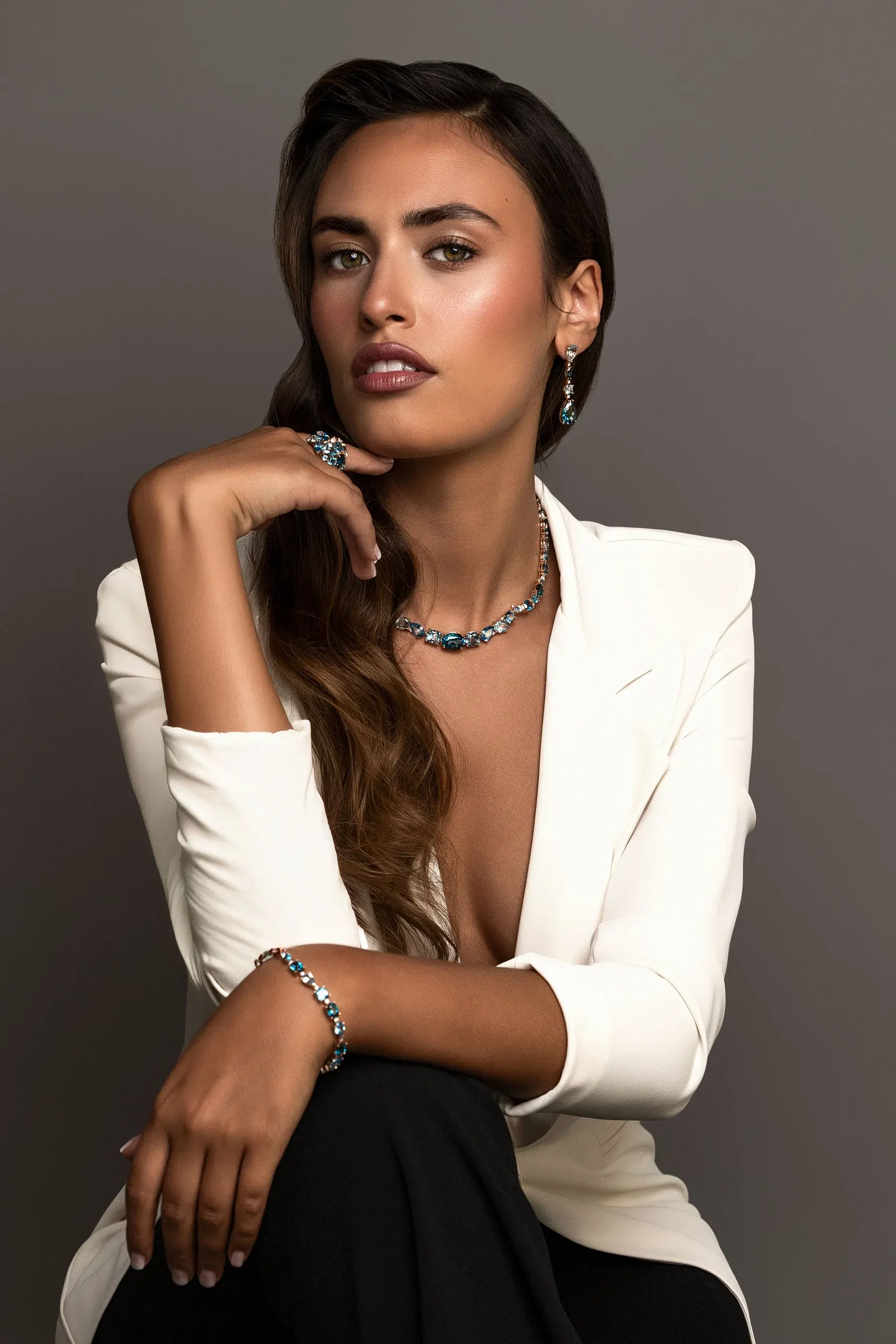 Model in a white jacket wearing Iris collection jewels – Ponte Vecchio Gioielli